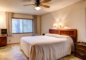 bedroom with queen bed and ceiling fan