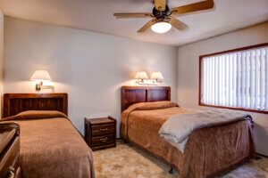 bedroom with two twin beds and ceiling fan
