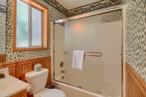 bathroom with shower tub and toilet