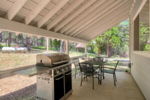 patio with cover, seating, and grill