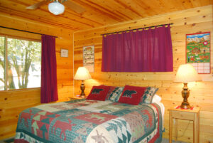 bedroom with queen bed and window