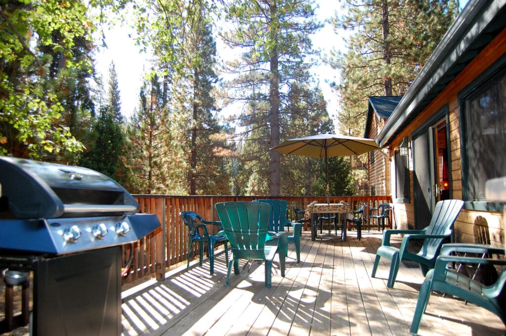 deck with grill and outdoor seating