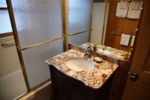 bath room with tub shower and vanity