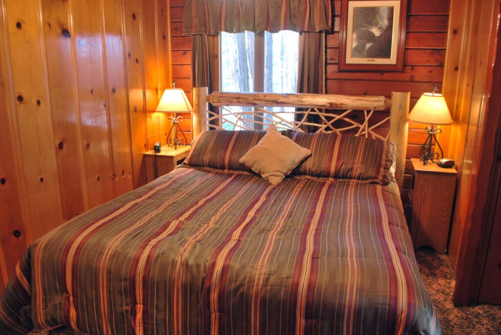 bedroom with wood carved bed frame