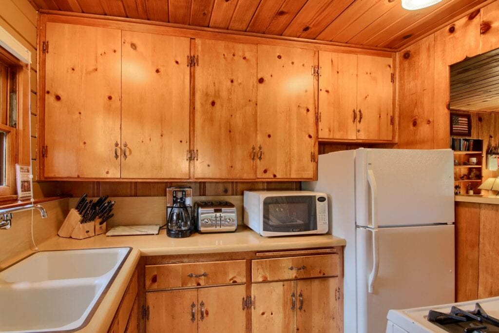 fully equipped kitchen with wood cabinets