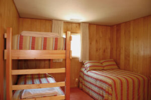 bedroom with twin bed and bunk beds