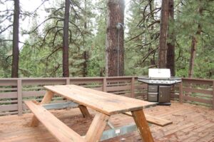 deck with outdoor seating and grill