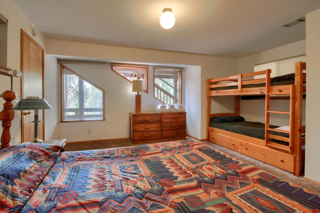 bedroom with queen bed and bunk bed