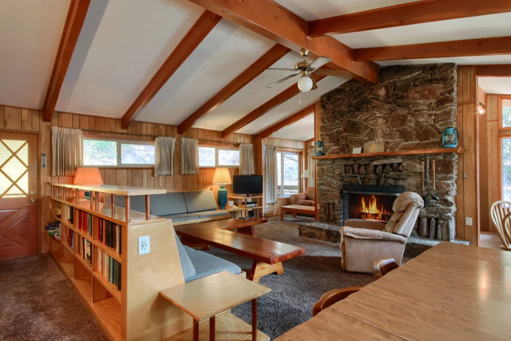 sunken living room with beams and mid century details