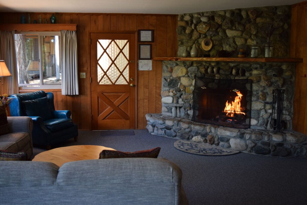 living room with stone fireplace