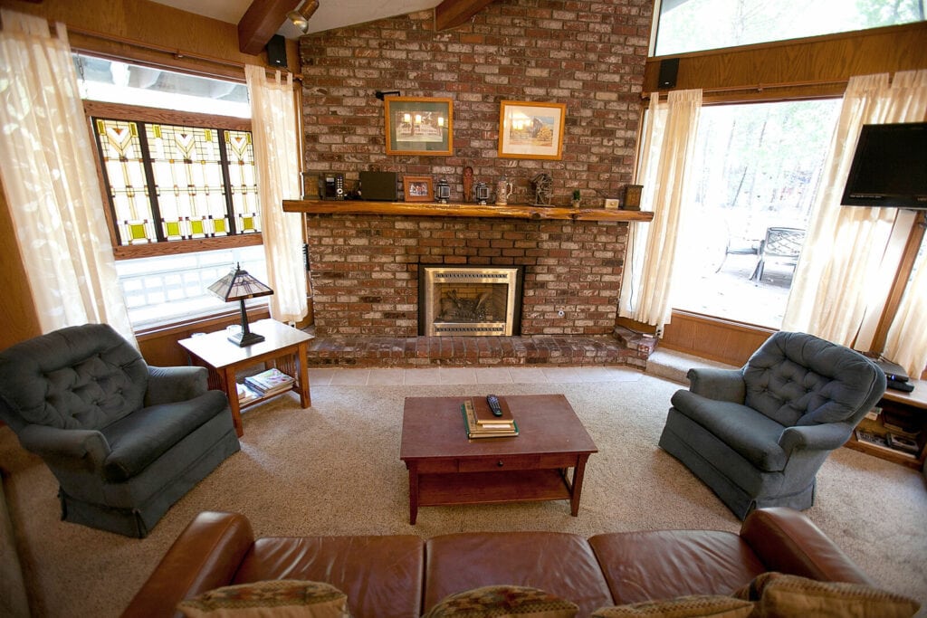 living area with stone fireplace