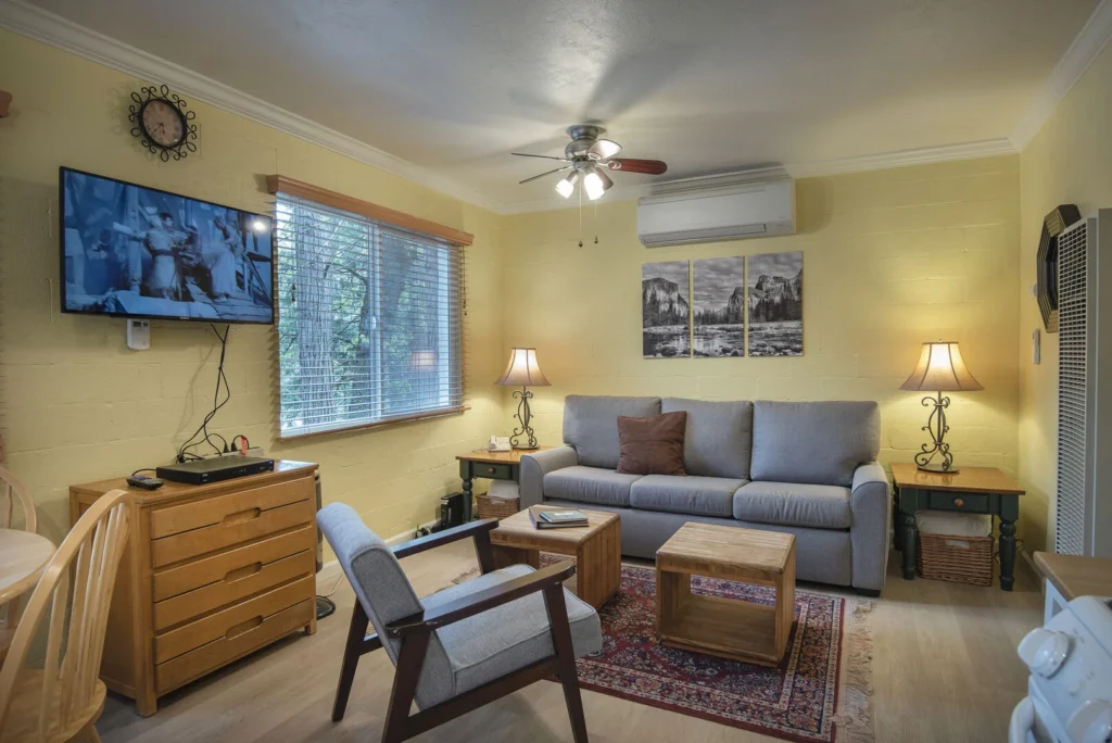 living area with seating and television