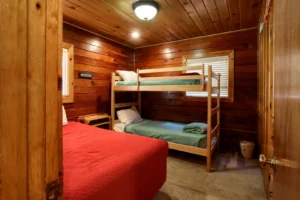 bedroom with full bed and bunk beds