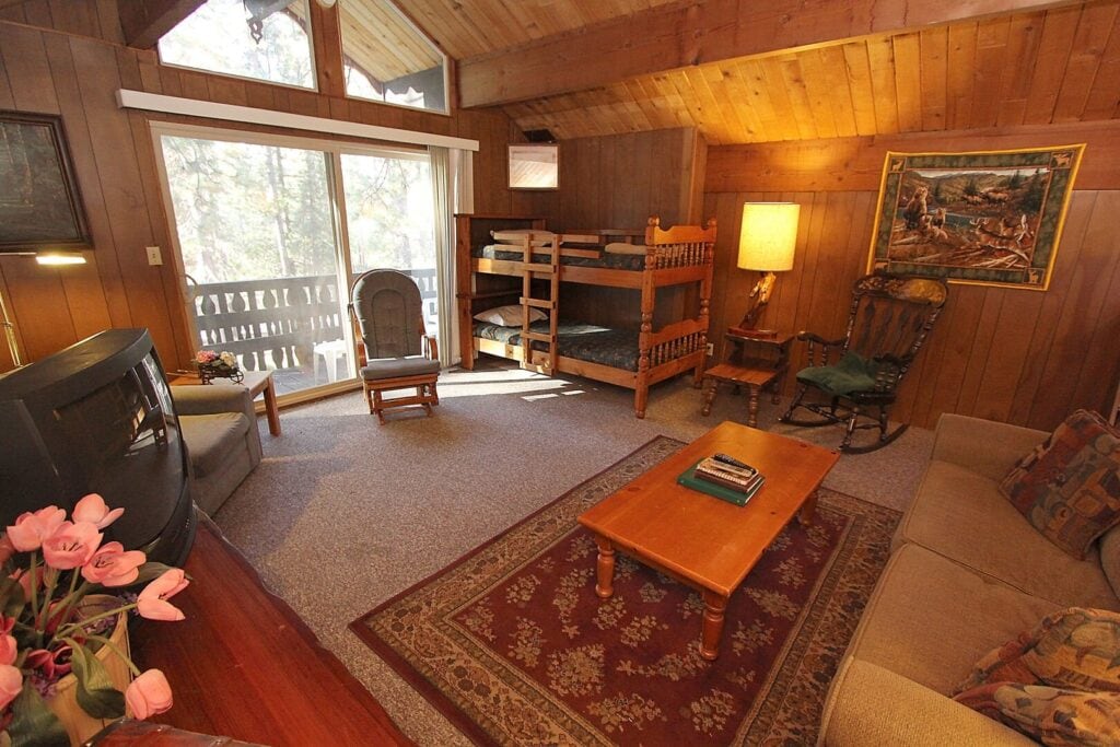 living area with vaulted ceilings with bunk beds