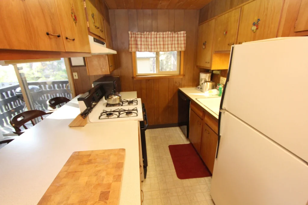 kitchen with white counters and wood cabinets