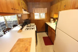 kitchen with white counters and wood cabinets