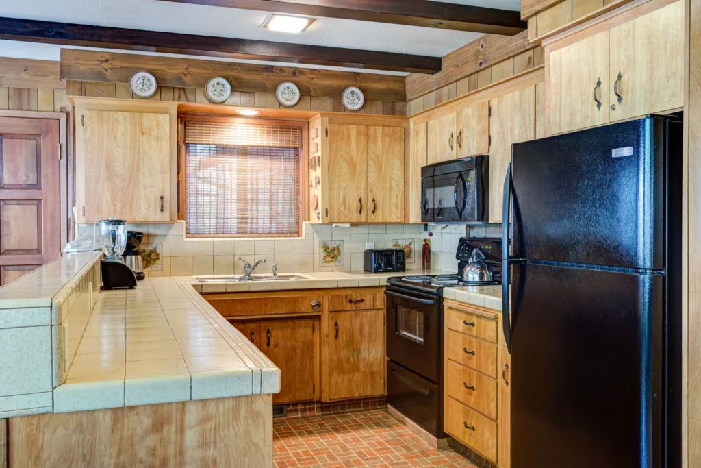 kitchen with wood cabinets and beams
