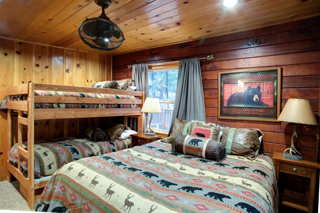 bedroom with queen bed and bunk beds