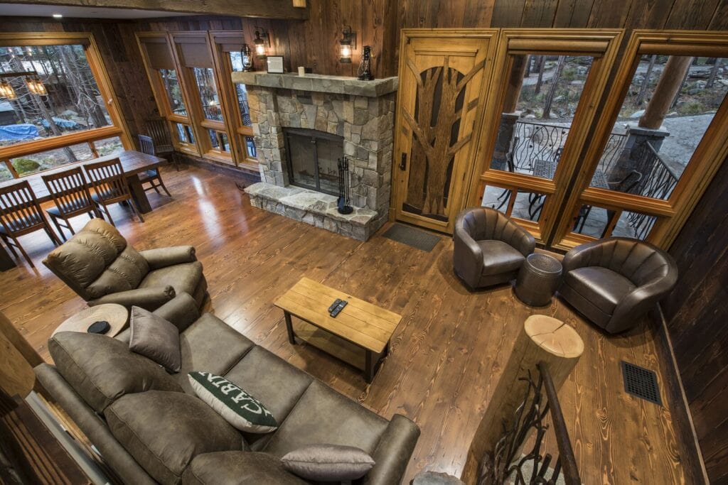 loft view of living room with seating and fireplace