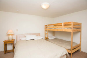 bedroom with queen bed and bunk bed
