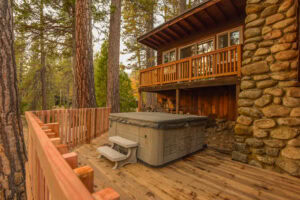exterior of cabin with hot tub