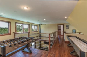 loft game room with game tables