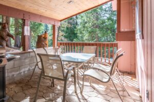 deck with outdoor seating and grill