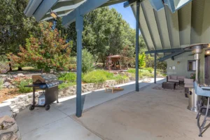 patio with grill and corn hole