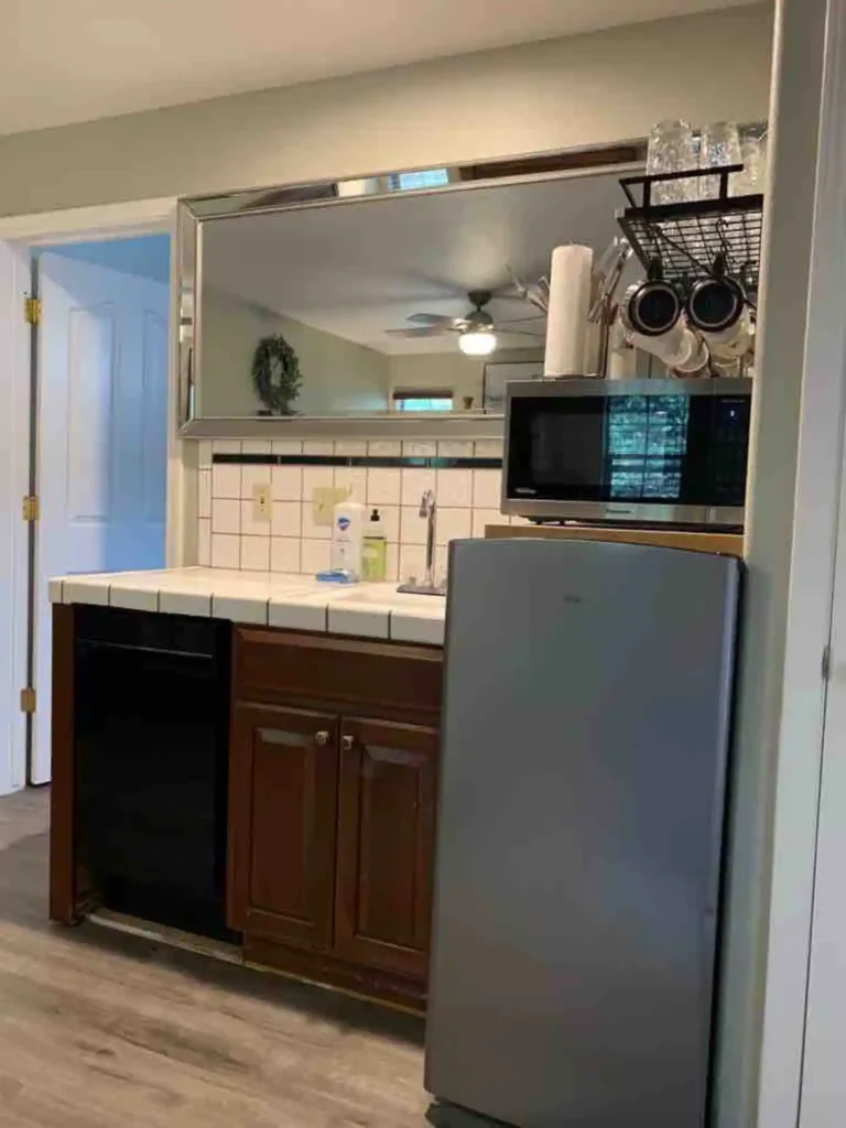kitchenette with microwave and fridge