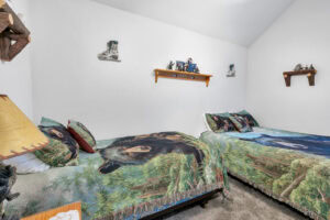 bedroom with twin and full beds