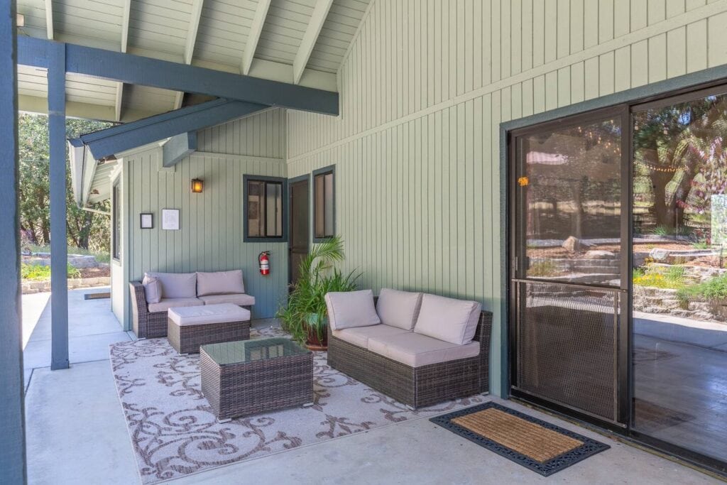 patio with outdoor seating and heat lamp