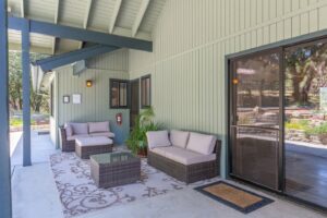 patio with outdoor seating and heat lamp