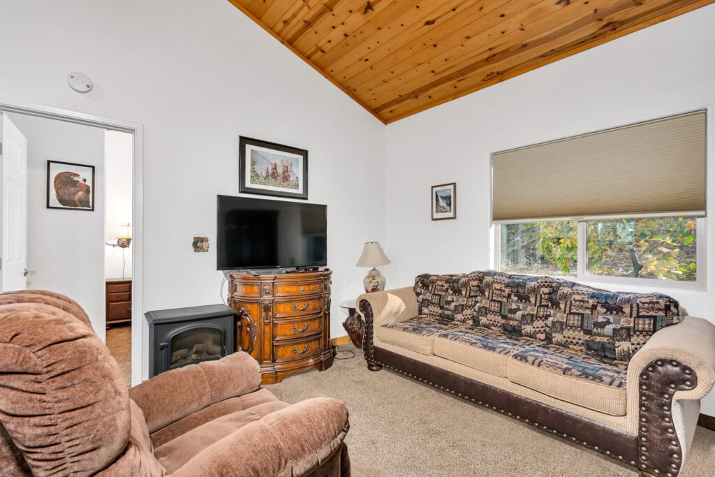 living room with television and seating