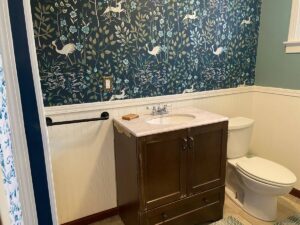 bathroom with patterned wallpaper