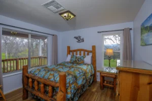 bedroom with carved wood full bed