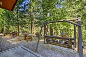 looking out from the front porch to a porch swing