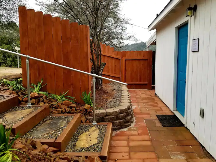 patio with stairs and fence