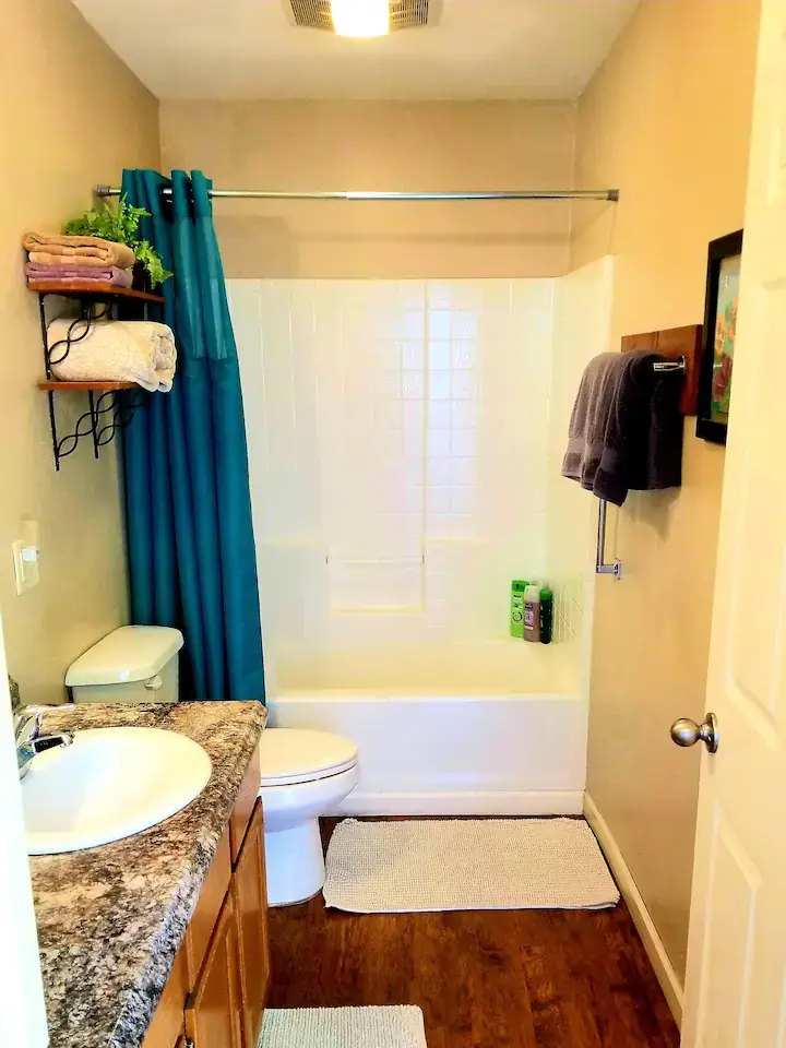 bathroom with shower and tub