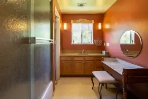 bathroom with shower tub combo and vanity