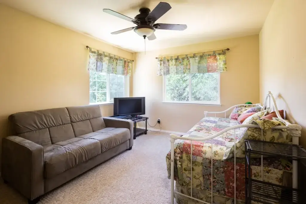 bedroom with daybed and couch