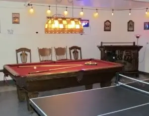 games room with pool and ping pong tables