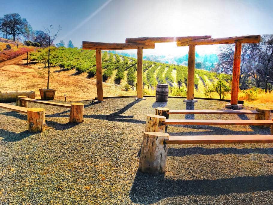 small wedding venue aisle overlooking vineyard