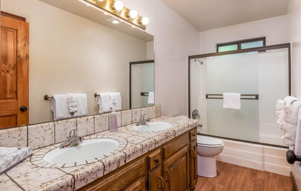 bathroom with shower tub and vanity