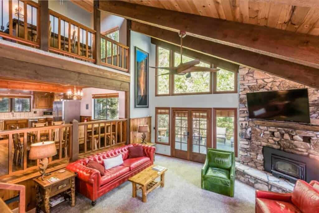 living room with fireplace and vaulted ceilings