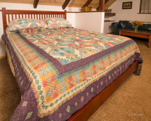 bedroom with colorful bedspread