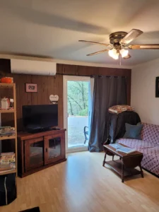 living area with couch and television