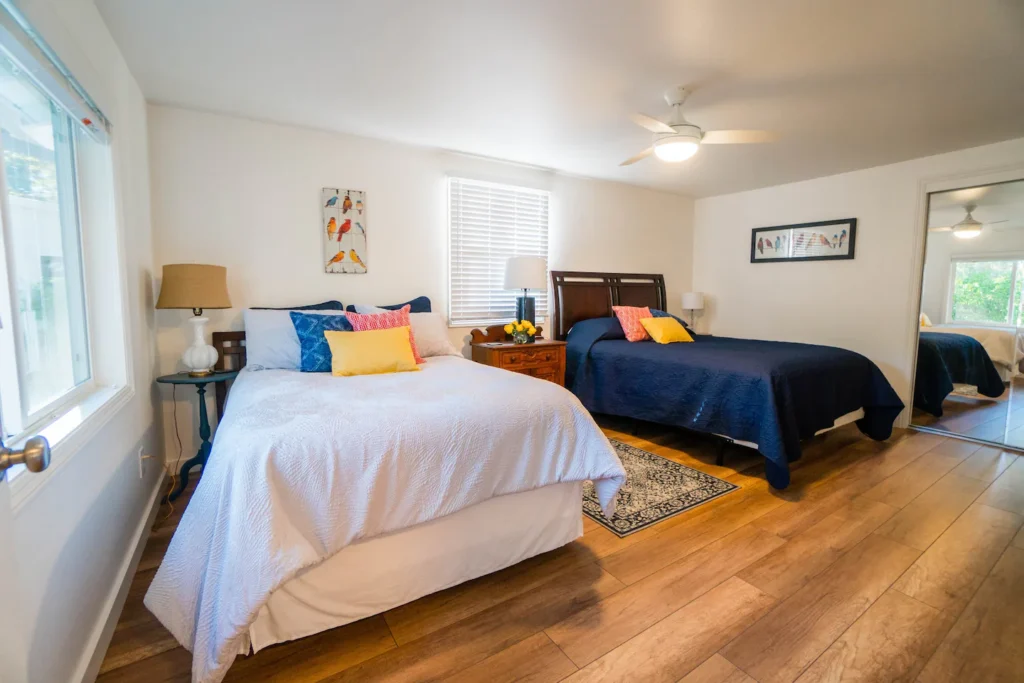 bedroom with queen bed and full bed