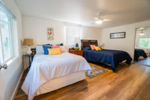 bedroom with queen bed and full bed