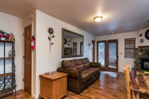 entrance with a couch next to dining area