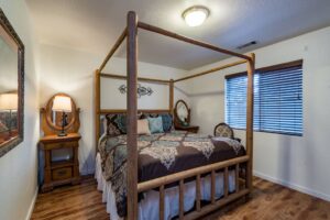 bedroom with queen bed with posts